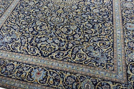 Close-up detail of 2000s Kashan rug from Iran / Persia showing Wool weave