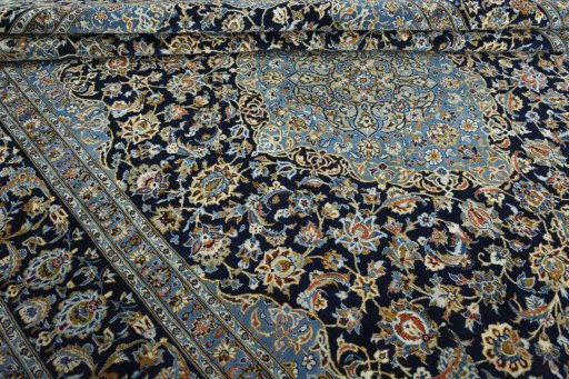 Close-up detail of 2000s Kashan rug from Iran / Persia showing Wool weave