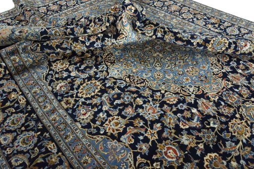 Surface texture of 2000s Kashan rug with natural Wool and intricate pattern