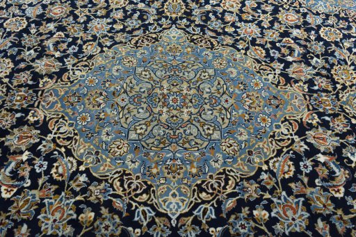 Central medallion detail of 2000s Kashan rug from Iran / Persia