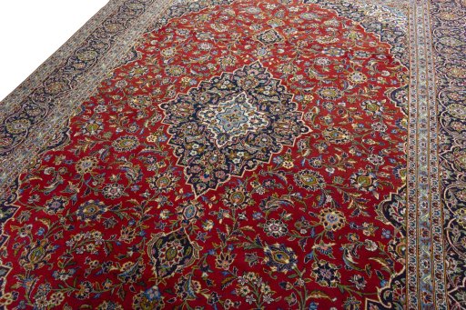 Backside of handmade 2000s Kashan rug showing knot structure and weave density