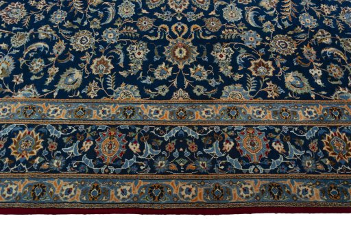Corner detail of 2000s Kashan rug showing border pattern and Wool pile