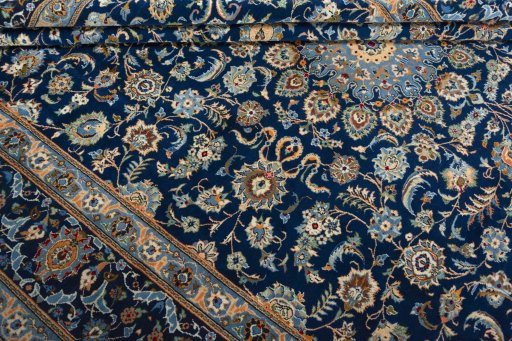 Close-up detail of 2000s Kashan rug from Iran / Persia showing Wool weave