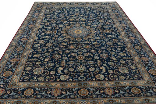 Surface texture of 2000s Kashan rug with natural Wool and intricate pattern