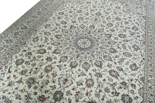 Backside of handmade 2000s Kashan rug showing knot structure and weave density