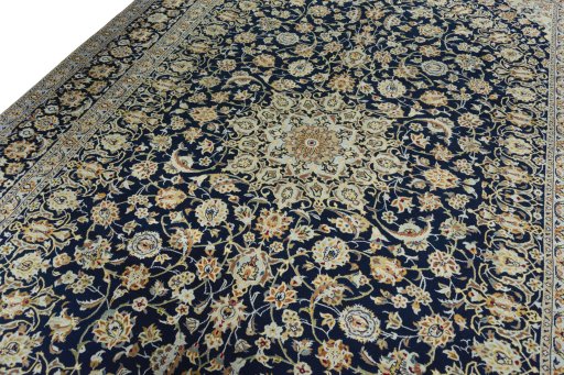 Backside of handmade 2000s Kashan rug showing knot structure and weave density