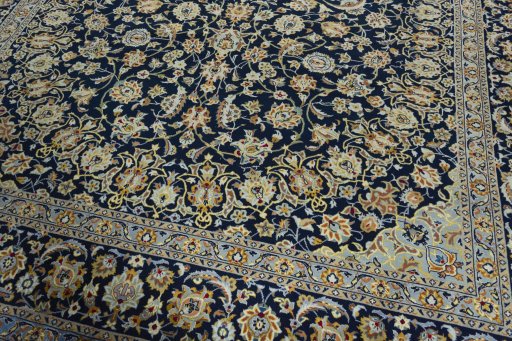 Close-up detail of 2000s Kashan rug from Iran / Persia showing Wool weave