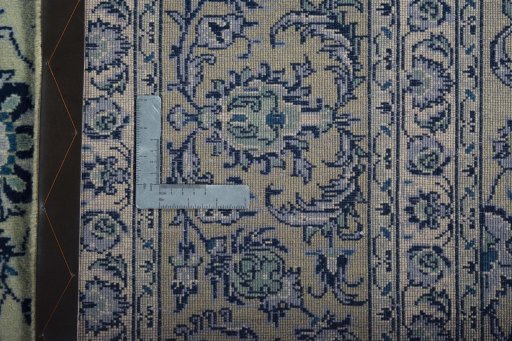 Backside of handmade 2000s Kashan rug showing knot structure and weave density