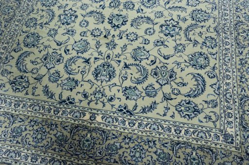 Close-up detail of 2000s Kashan rug from Iran / Persia showing Wool weave