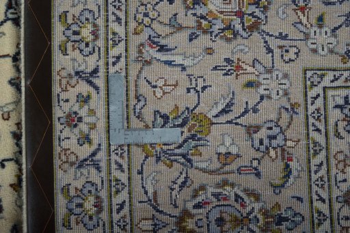 Backside of handmade 2000s Kashan rug showing knot structure and weave density