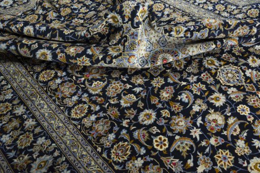 Surface texture of 2000s Kashan rug with natural Wool and intricate pattern