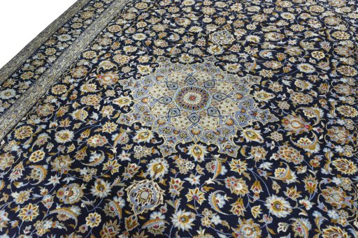 Backside of handmade 2000s Kashan rug showing knot structure and weave density