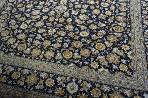 Close-up detail of 2000s Kashan rug from Iran / Persia showing Wool weave