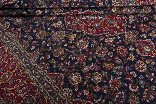 Close-up detail of 2000s Kashan rug from Iran / Persia showing Wool weave