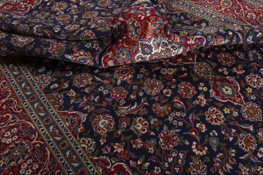 Surface texture of 2000s Kashan rug with natural Wool and intricate pattern