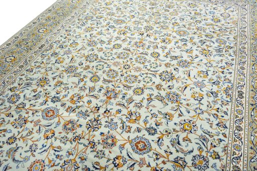 Backside of handmade 2000s Kashan rug showing knot structure and weave density