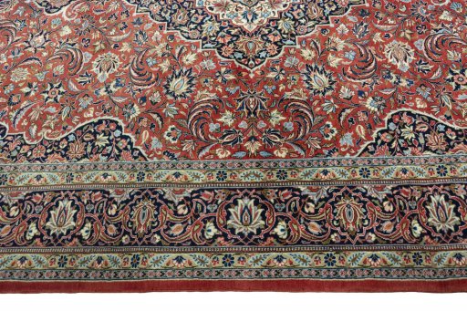 Corner detail of New Kashan rug showing border pattern and Cork pile
