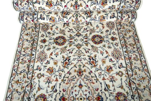 Corner detail of New Kashan rug showing border pattern and Wool pile