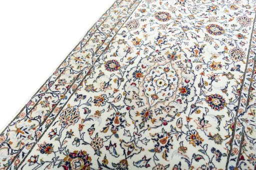 Backside of handmade New Kashan rug showing knot structure and weave density