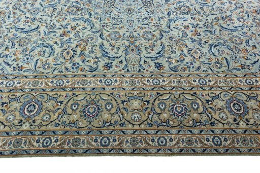Corner detail of 2000s Kashan rug showing border pattern and Wool pile