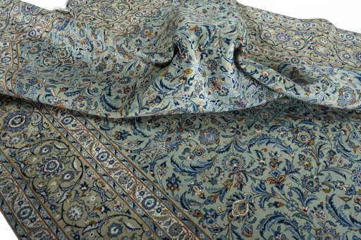 Surface texture of 2000s Kashan rug with natural Wool and intricate pattern