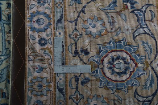 Backside of handmade 2000s Kashan rug showing knot structure and weave density