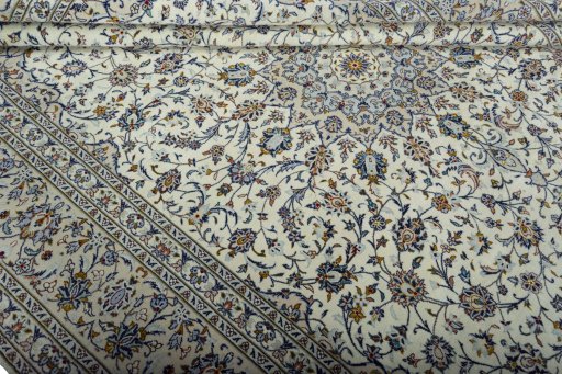 Close-up detail of 2000s Kashan rug from Iran / Persia showing Wool weave