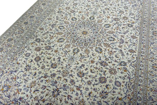 Backside of handmade 2000s Kashan rug showing knot structure and weave density