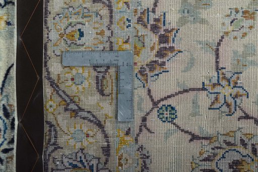 Surface texture of 2000s Kashan rug with natural Wool and intricate pattern