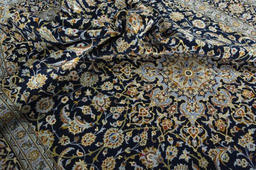 Surface texture of 2000s Kashan rug with natural Wool and intricate pattern
