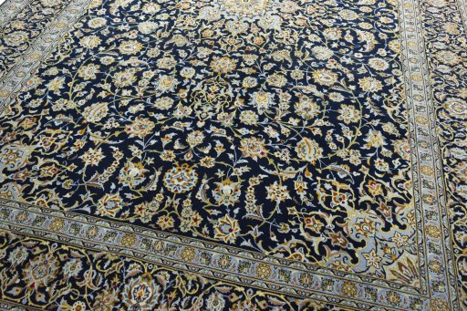 Close-up detail of 2000s Kashan rug from Iran / Persia showing Wool weave