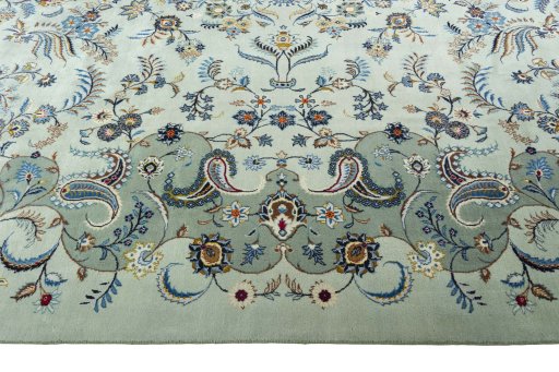Corner detail of 2000s Kashan rug showing border pattern and Wool pile