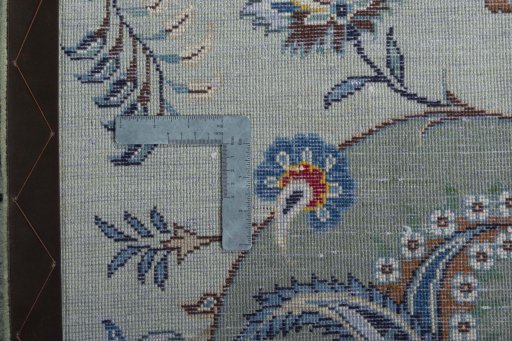 Backside of handmade 2000s Kashan rug showing knot structure and weave density