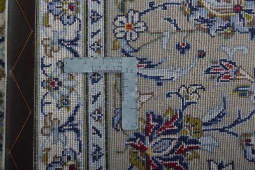 Backside of handmade 2000s Kashan rug showing knot structure and weave density