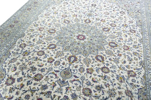 Backside of handmade 2000s Kashan rug showing knot structure and weave density