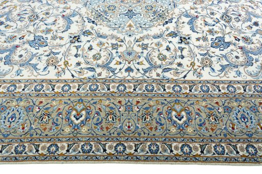 Corner detail of 2000s Kashan rug showing border pattern and Wool pile