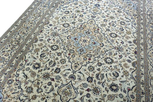 Backside of handmade 2000s Kashan rug showing knot structure and weave density