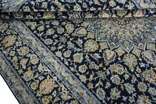 Close-up detail of 2000s Kashan rug from Iran / Persia showing Wool weave