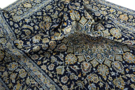 Surface texture of 2000s Kashan rug with natural Wool and intricate pattern