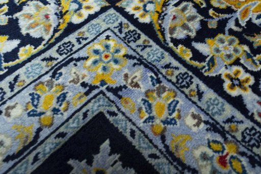 Central medallion detail of 2000s Kashan rug from Iran / Persia