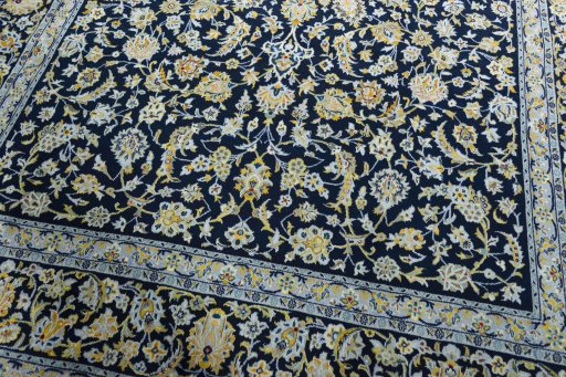 Close-up detail of 2000s Kashan rug from Iran / Persia showing Wool weave