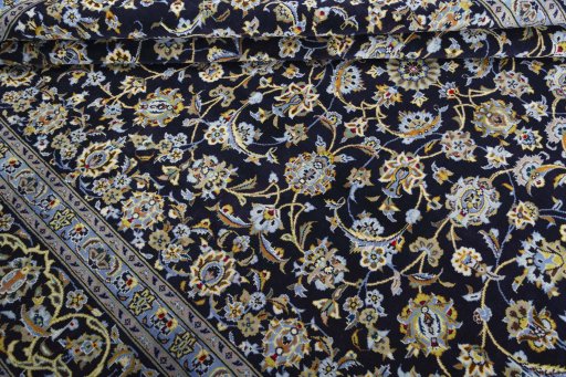 Close-up detail of 2000s Kashan rug from Iran / Persia showing Wool weave
