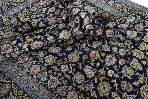 Surface texture of 2000s Kashan rug with natural Wool and intricate pattern