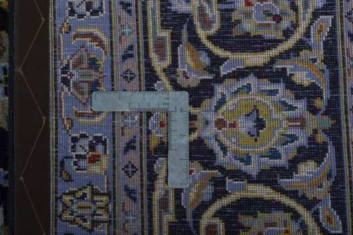 Backside of handmade 2000s Kashan rug showing knot structure and weave density