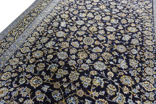 Backside of handmade 2000s Kashan rug showing knot structure and weave density