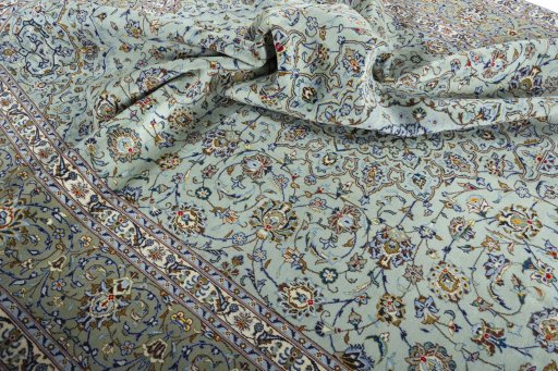 Surface texture of 2000s Kashan rug with natural Wool and intricate pattern