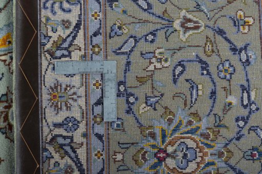 Backside of handmade 2000s Kashan rug showing knot structure and weave density