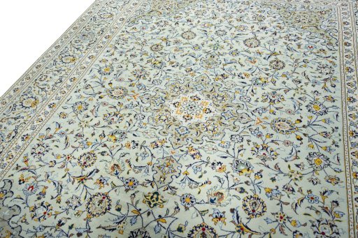 Backside of handmade 2000s Kashan rug showing knot structure and weave density