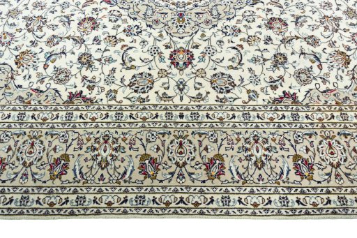 Corner detail of 2000s Kashan rug showing border pattern and Wool pile