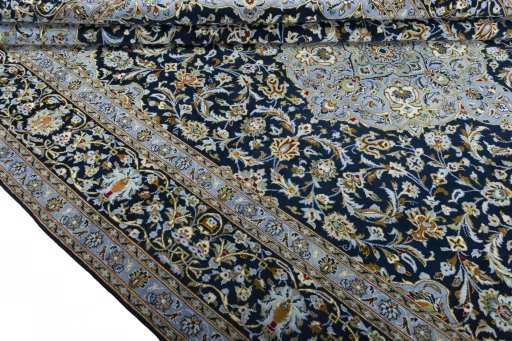 Close-up detail of 2000s Kashan rug from Iran / Persia showing Wool weave